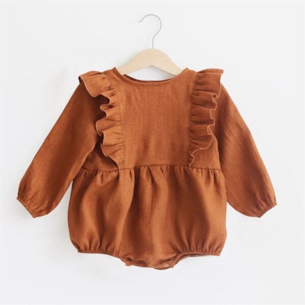 Rust-colored baby romper with ruffle details on the shoulders, made from soft, comfortable fabric. P.