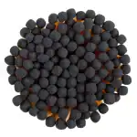 Black peppercorns in a circular arrangement, close-up shot.
