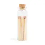 Small glass jar filled with wooden matches and a cork lid.