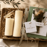 Luxury candle gift bundle featuring hand-poured ribbed soy wax pillar candles, a woven seagrass decorative tray, and a plantable wildflower greeting card styled for cozy home décor and elevated gifting.