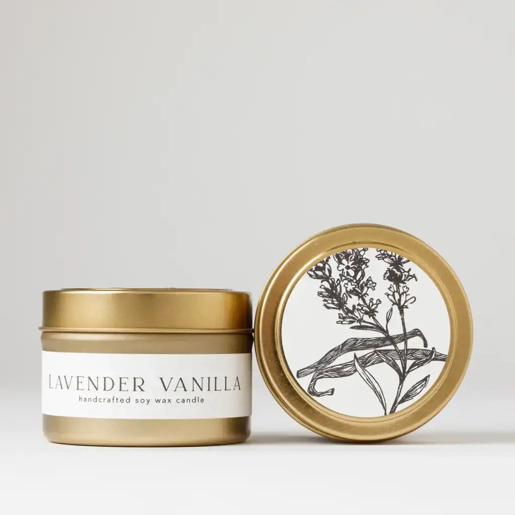 Lavender vanilla soy wax candle in a stylish gold tin, perfect for relaxation and home ambiance.