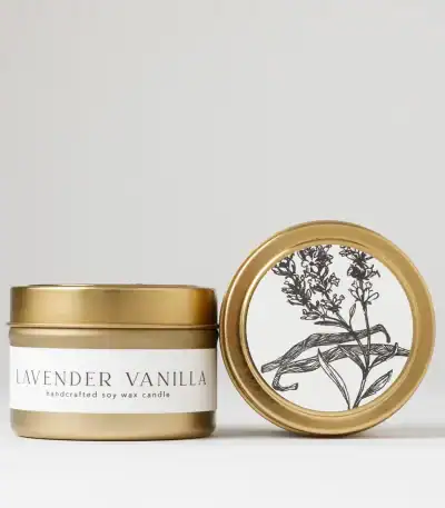 Lavender vanilla soy wax candle in a stylish gold tin, perfect for relaxation and home ambiance.