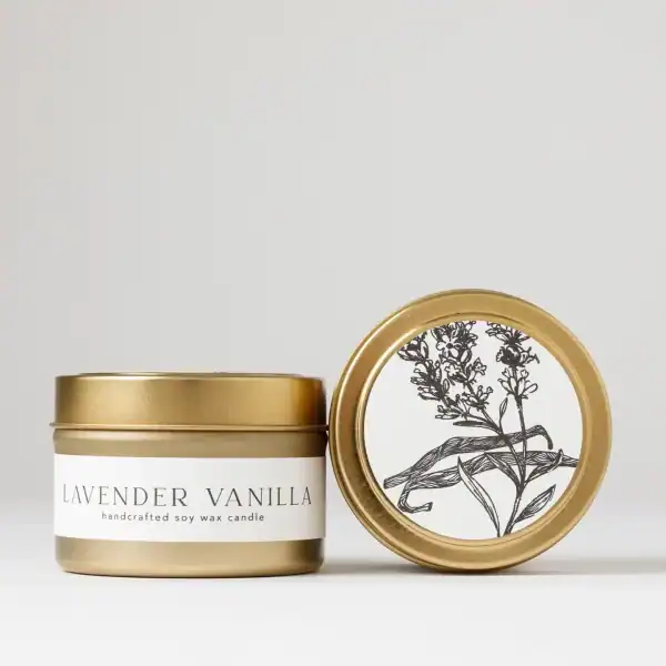 Lavender vanilla soy wax candle in a stylish gold tin, perfect for relaxation and home ambiance.