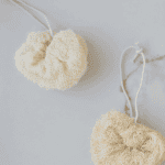 Soft, natural exfoliating body scrubbers with adjustable cords for gentle skincare routines. Perfect.