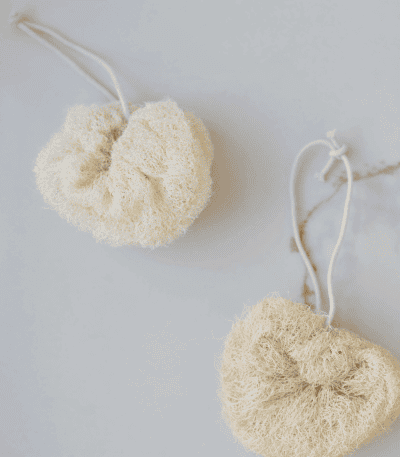 Soft, natural exfoliating body scrubbers with adjustable cords for gentle skincare routines. Perfect.