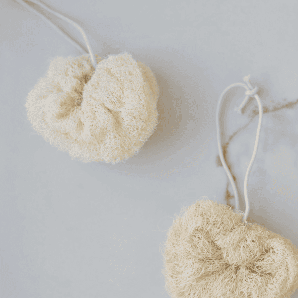 Soft, natural exfoliating body scrubbers with adjustable cords for gentle skincare routines. Perfect.