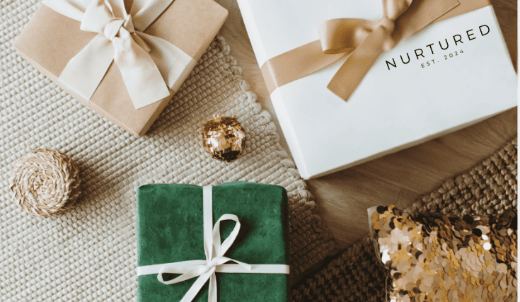 Elegant gift boxes with "Nurtured" branding and festive decorations for special occasions.