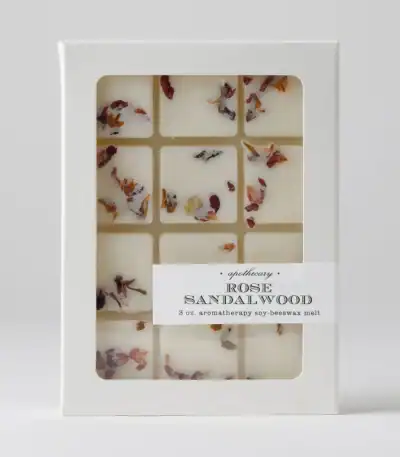 Aromatherapy soy beeswax melt with rose sandalwood scent in a white box.
