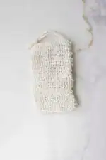 Soft white reusable mesh bag for eco-friendly shopping and storage.