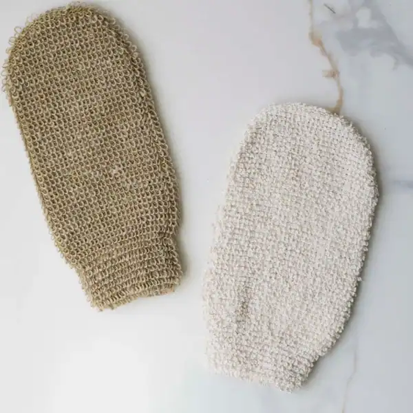 Soft exfoliating bath mitts in neutral tones for skincare routines.