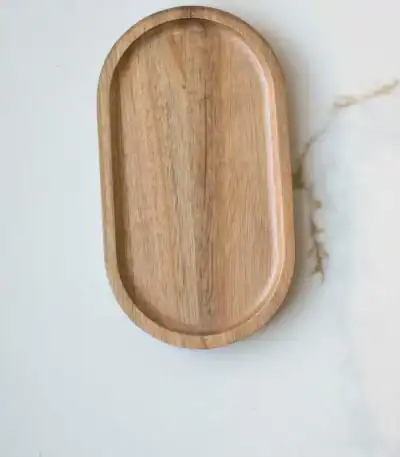 Wooden serving tray on white marble surface, minimalist kitchen accessory.