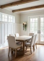 Bright dining room with natural light, wooden beams, and elegant furniture for a cozy home setting.