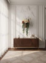 Elegant floral arrangement with white, pink, and beige flowers on a wooden sideboard in a modern, br.