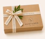 Nurtured signature gift wrapping service featuring a premium keepsake gift box with ribbon and botanical accents for beautifully packaging your selected gifts.