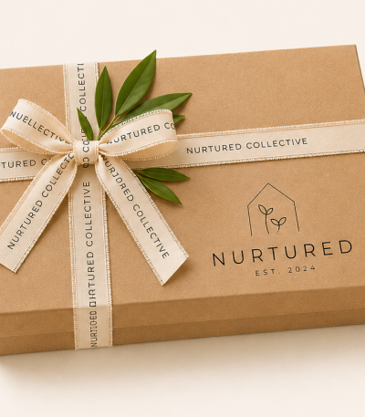 Nurtured signature gift wrapping service featuring a premium keepsake gift box with ribbon and botanical accents for beautifully packaging your selected gifts.